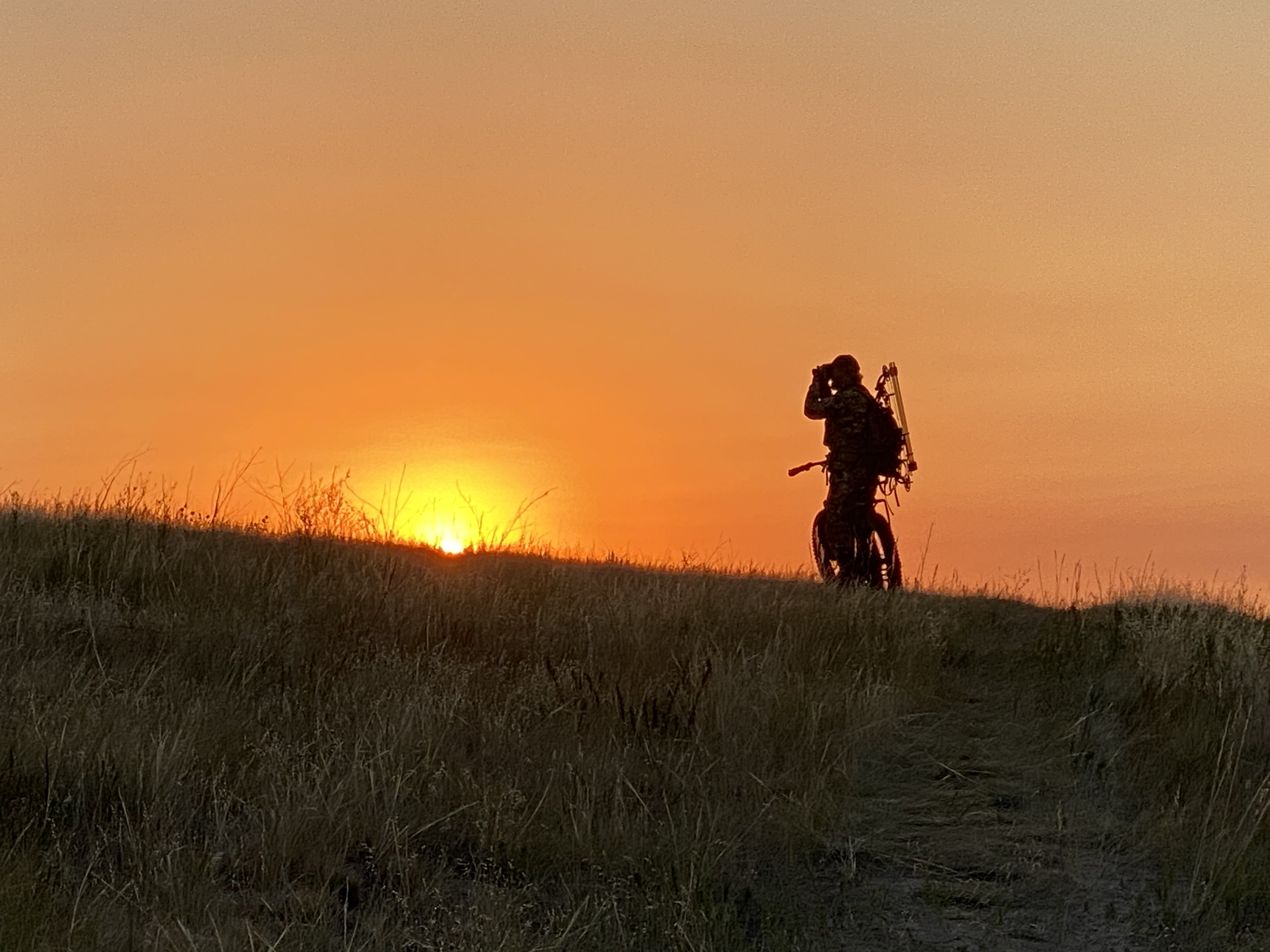 Hunter silhouette at sunset